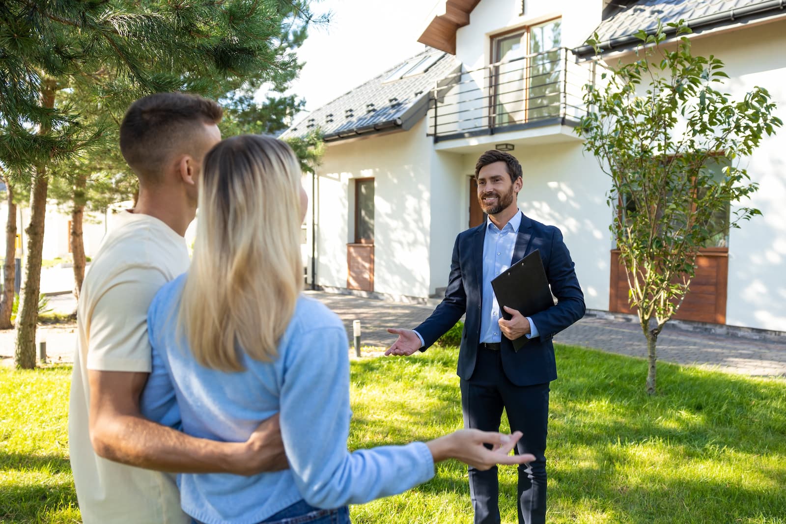 Palm Coast Real Estate agent handing keys to new homeowners